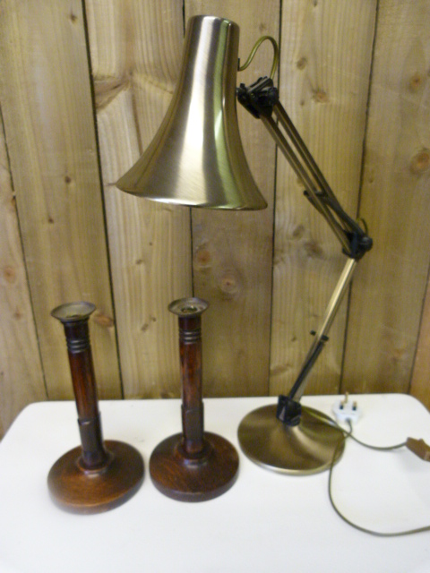 A Modern Angle poise lamp and a pair of turned oak candlesticks