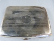 A Hallmarked silver cigarette case with leather pouch inside (dented to the outside) total weight