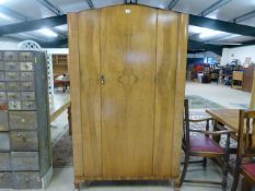 A Large walnut veneered double wardrobe