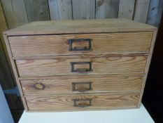 A smaller oak specimen chest of four drawers