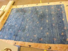 An Eastern blue ground rug 258x185cm