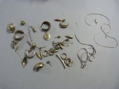 A Small quantity of scrap silver to include earrings and chains etc 63.1g