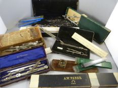 A quantity of mathematical equipment in cases - slide rules etc