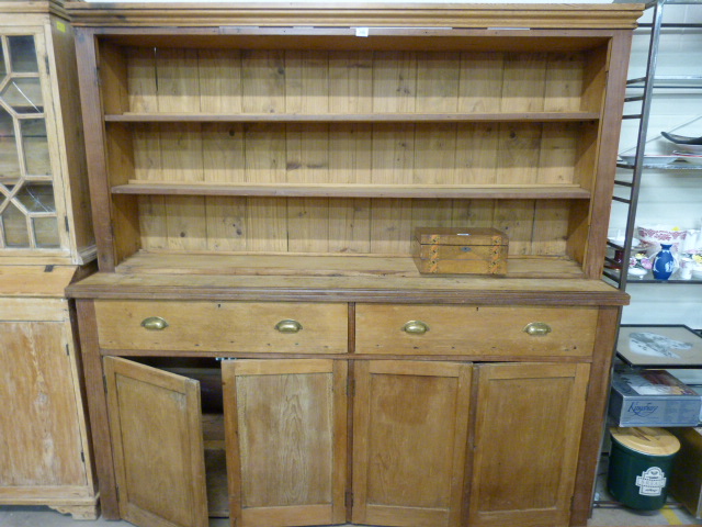 A antique pine dresser with 2 drawers and 2 cupboards