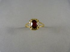 A Garnet and diamond ring