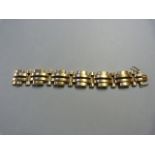A 9ct Gold Hallmarked 'Gate' bracelet with safety catch - total weight 36.2g