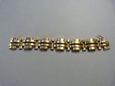 A 9ct Gold Hallmarked 'Gate' bracelet with safety catch - total weight 36.2g