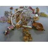 A small quantity of costume jewellery to include mainly brooches, Rolled Gold watch strap and a