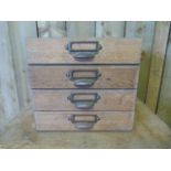 A Pine filing chest of four drawers