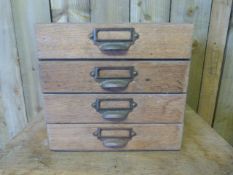 A Pine filing chest of four drawers