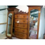 A Victorian mahogany wardrobe with central drawer section