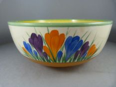 A Royal Staffordshire Clarice Cliff bowl in the Crocus design on a Honey Glaze background