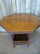 An octagonal mahogany occasional table