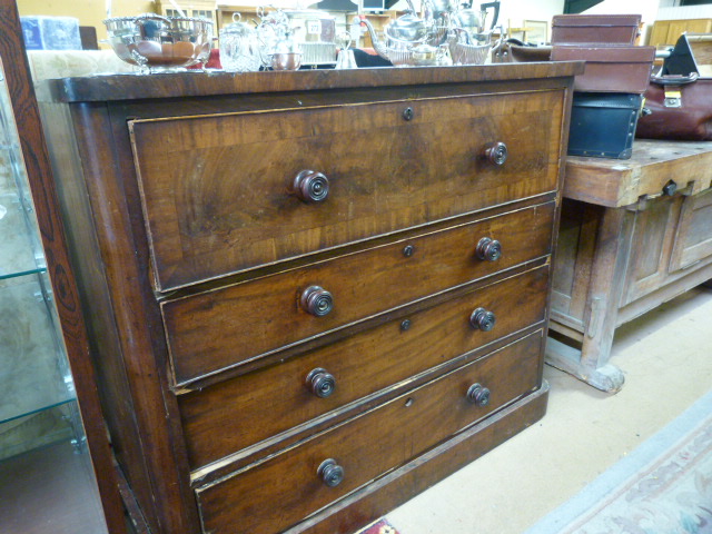 A 4 draw mahogany chest of drawers in need of some restoration.