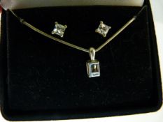 A hallmarked silver pendant on silver chain with matching earrings