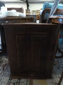 An oak hanging cupboard