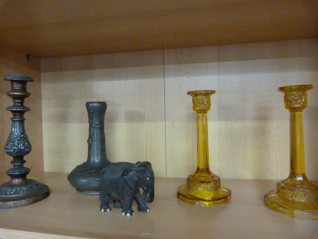 A pair of Amber coloured candlesticks (1A/F), a SCM candlestick and pewter vase