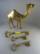 A Brass figure of a camel, three large brass keys .
