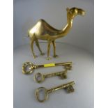 A Brass figure of a camel, three large brass keys .