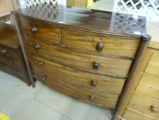 Mahogany bow fronted chest of drawers with barley twist pillars