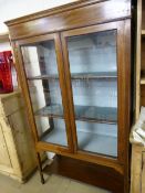 An Edwardian inlaid display cabinet