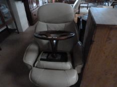 A cream leather reclining swivel chair with matching footstool