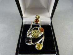 Silver Ring with 4 various amber stones