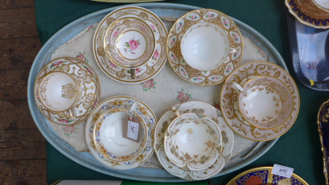 Selection of 6 gilt and white ground cups and saucers from popular factories including Daniels,