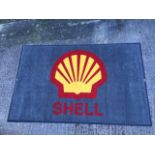 A Shell showroom mat.