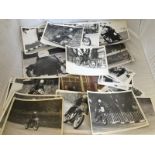 A good collection of mostly black and white photographs of motorcycles either during competition