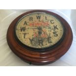 A rare Warwick Tyres mahogany cased dial clock with original advertising to the face, bearing the