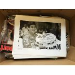 A large box of ephemera and brochures relating to motor sport including limited edition prints of