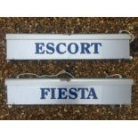 A pair of showroom illuminated lightboxes for Ford Escort and Ford Fiesta, each approximately 38 x 8