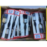A box of garage shop display brushes with Mobil Super advertising on each card.