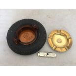 A Firestone Tyres ashtray with amber glass centre, a brass ashtray with Shell Motor Oil Gasoline