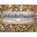 A Mobiloil oil bottle crate front sign.