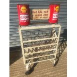 A Shell X-100 Motor Oil forecourt oil bottle rack with dummy can pediment.