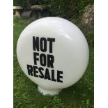 A 'Not for resale' glass petrol pump globe.