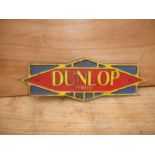 A Dunlop Tyres agent wall plaque.
