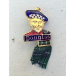 A Douglas part enamel lapel badge in the form of a Scotsman made by H.W. Miller. Provenance: by