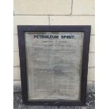 An oak framed and glazed 'Conditions of License for Petroleum Spirit', issued by The Weights and