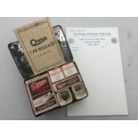 An Osram car bulb kit with contents and a selection of Notting Hill Garage Limited headed paper.