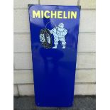 A Michelin Tyres part pictorial enamel sign with space for a chart attachment, the enamel with