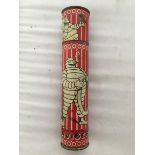 An early Michelin cylindrical tinplate chalk tin, decorated with scenes of Mr. Bibendum looking in a