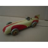 A Chad Valley clockwork tinplate model of a single seater Land Speed Record car.