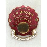 A red and white enamel shell-shaped supply plate for J.P. Brown Central Garage, Fishguard, 'Use