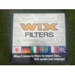 A Wix Filters embossed car tin advertising sign, 25 1/2 x 23 1/2".