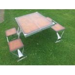 A Selvart Products four-fold picnic table with fold-out combined seats, circa 1960s, of aluminium