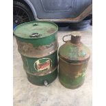 A Castrol Motor Oil 10 gallon drum and a Castrol five gallon conical oil drum.