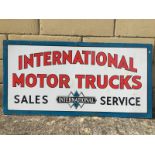 A rare International Motor Trucks Sales and Service rectangular double sided enamel sign with